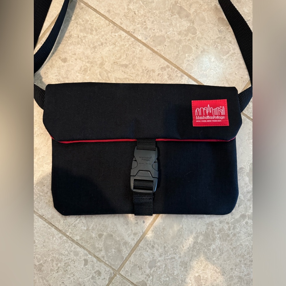 MANHATTAN PORTAGE crossbody.  Black with red lining.